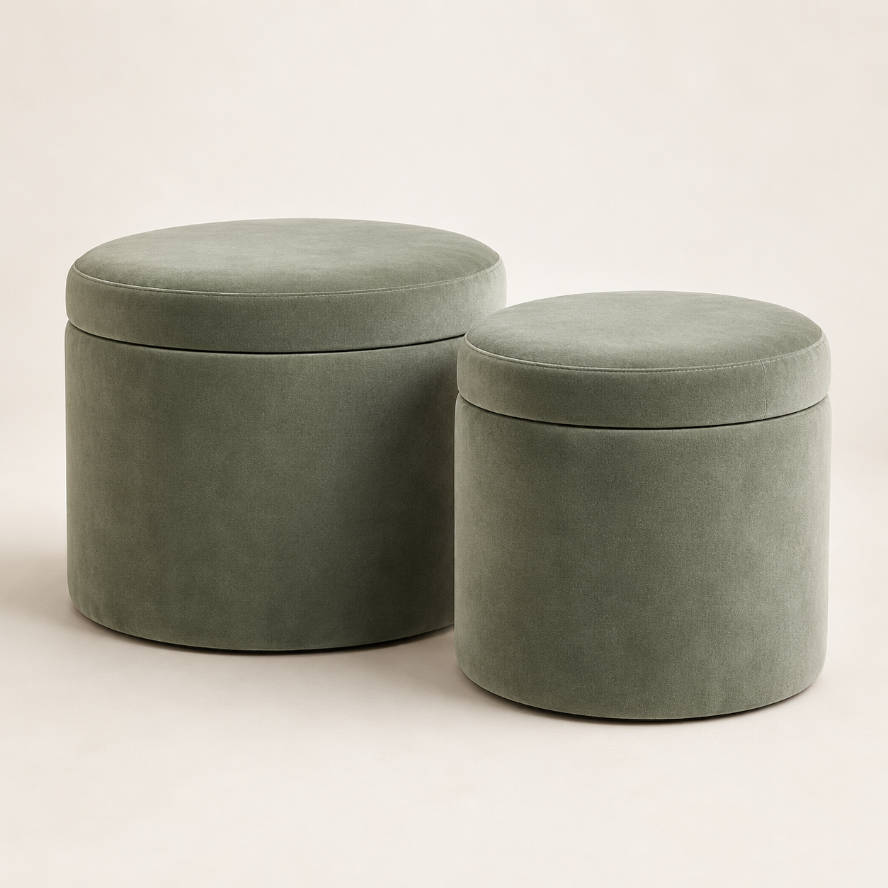 Example of a matching pair of round sage velvet storage ottomans